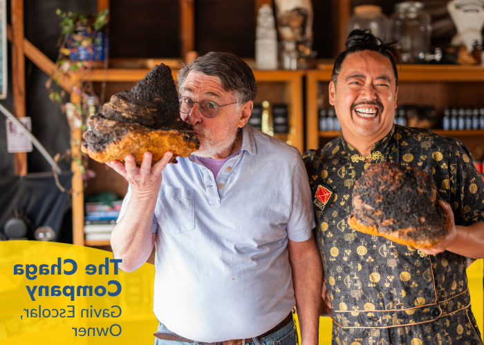 Gavin Escolar owner of The Chaga Company with SCORE Mentor Pete Slosberg holding chaga mushrooms.